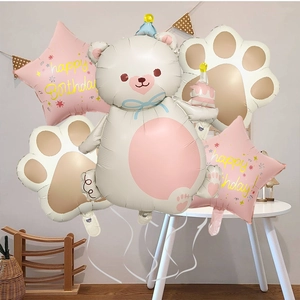 Detail of cute bear and pink star foil balloons for children birthday party decor