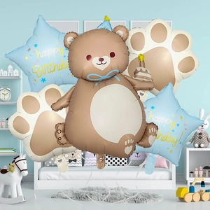 Detail of bear cake balloon set with paw prints and star balloons for kids birthday party