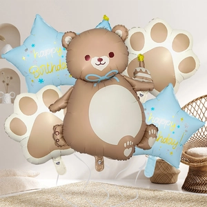 5-piece birthday balloon set with brown bear, blue stars, and cream paw prints decorations