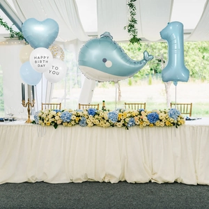 Detail of blue whale and number one balloons for boy first birthday party decoration