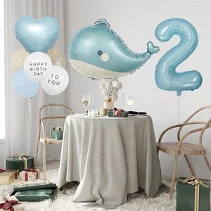 Detail of blue whale balloon and number 2 foil balloon for ocean theme birthday party decor