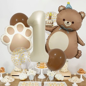 Detail of bear themed birthday balloon set with number one and neutral party decor