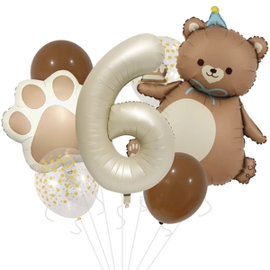 Detail of 6th birthday balloon set with matte bear and number six in earthy tones