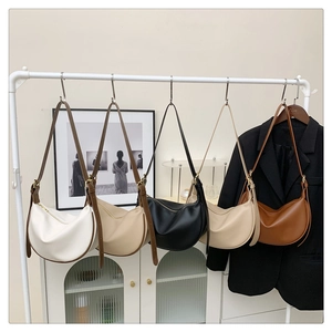 Detailed display of assorted hobo bags in five colors with adjustable shoulder straps