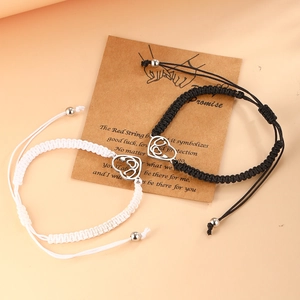Handmade braided friendship bracelets with heart charms on pinky promise card