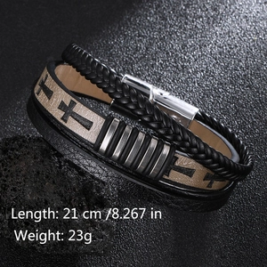 Detail of multi-layer braided leather bracelet with cross print and magnetic metal clasp