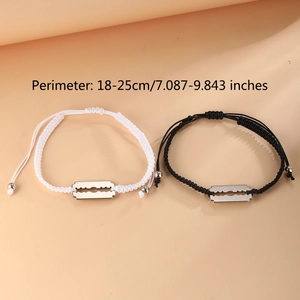 Detail of woven rope bracelets with razor blade pendant and adjustable drawstring
