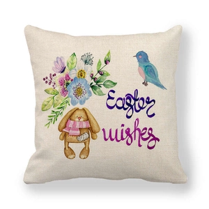 Detail of linen Easter pillow cover with watercolor bunny, flowers and Easter wishes text