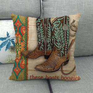Detail of vintage cowboy boots linen pillowcase on a grey sofa with western print decor