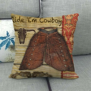 Linen pillowcase with vintage cowboy print and Ride Em Cowboy text on gray sofa