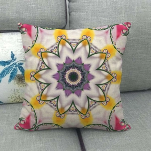 Detail of artistic kaleidoscope floral pattern on a textured linen pillow case