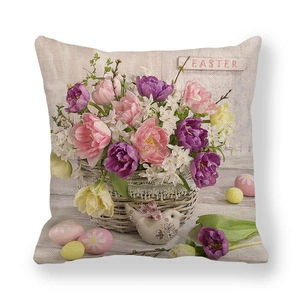 Close-up of Easter linen pillow cover with tulips, eggs, and bird on a white background