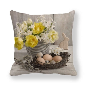 Detailed close-up of Easter linen pillowcase with tulip, bunny and bird nest prints