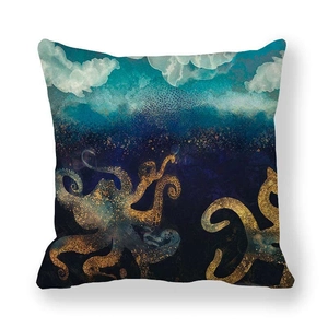 Detail of dark blue and gold octopus print cushion cover on peach skin fabric texture