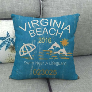 Close-up of linen fabric texture on Virginia Beach teal cushion cover on a sofa