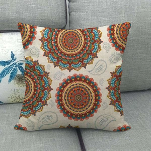 Detail of bohemian mandala and paisley pattern on square linen cushion cover