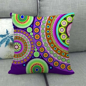 Detailed close-up of a purple linen pillowcase with a vibrant mandala geometric pattern