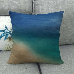 Detail of square cushion cover featuring artistic blue, green and sand gradient textures