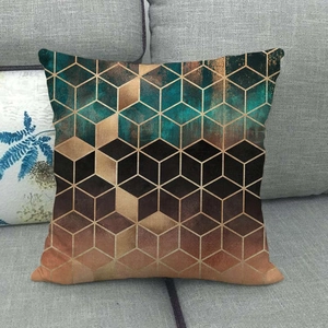 Detail of 3D geometric marble pattern cushion cover on a modern gray fabric sofa