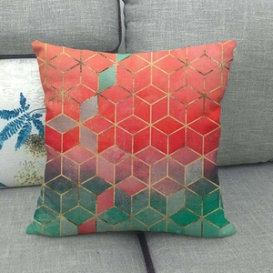 Detail of linen cushion cover featuring a 3D geometric marble cube pattern with gold lines