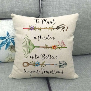 Linen pillowcase detail featuring gardening tools, butterflies and inspirational quote