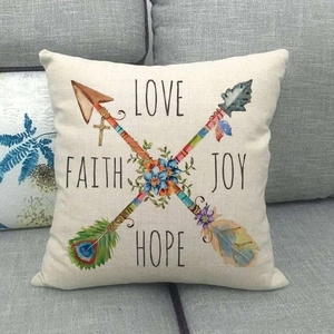 Detailed close-up of linen pillowcase with arrows, floral design and motivational text