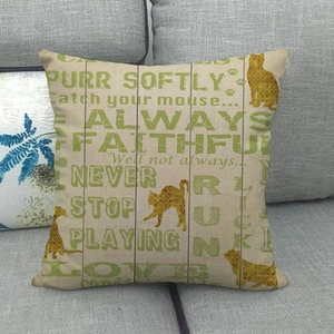 Close-up of linen pillow cover with cat silhouette and Purr Softly typographic print