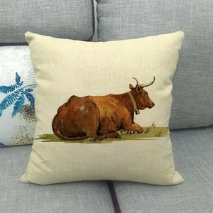 Macro detail of the rustic cotton linen cushion cover featuring a vintage bull oil painting