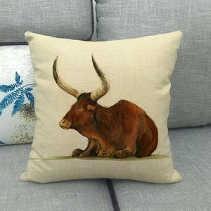 Detailed close-up of colorful bull oil painting on a square linen cushion cover