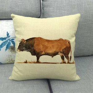 Detailed texture of a linen pillowcase featuring a watercolor brown bull print on a sofa