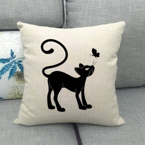 Close-up of linen cushion cover texture with minimalist black cat and butterfly print