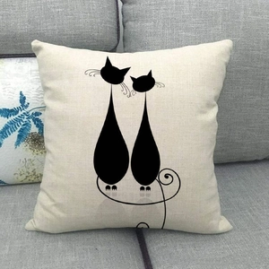 Detailed texture of linen pillowcase featuring minimalist black cat silhouette on a gray sofa