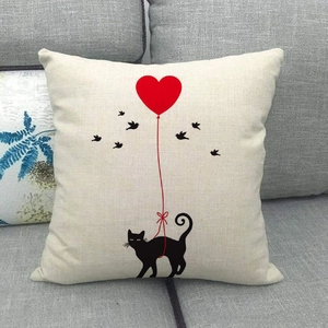 Detailed texture of linen cushion cover featuring a cat and red heart balloon print