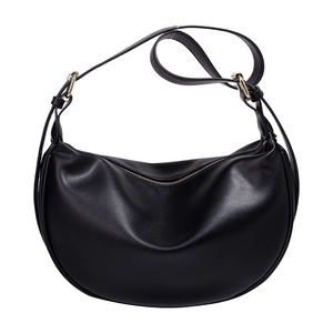Classic black leather half-moon crossbody bag with gold metal rings and zipper closure