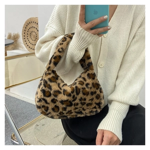 Detail of leopard print faux fur tote bag with a soft plush texture for autumn fashion