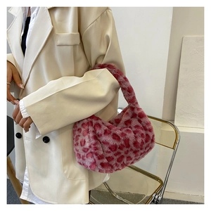 Pink leopard print faux fur shoulder bag with a crescent moon silhouette and soft texture