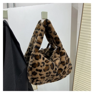 Detail of soft leopard print faux fur shoulder bag with zip closure for winter