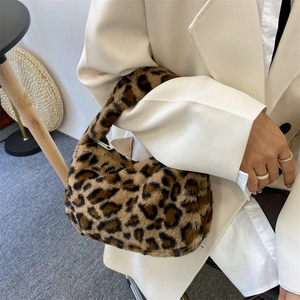 Chic leopard print plush handbag with brown faux fur and retro hobo saddle shape