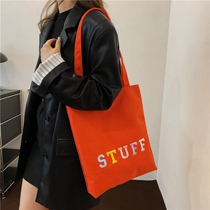 Chic bright orange canvas tote bag with bold STUFF letter embroidery and large capacity