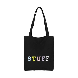 Large black canvas tote bag with colorful STUFF embroidery for daily casual shopping use