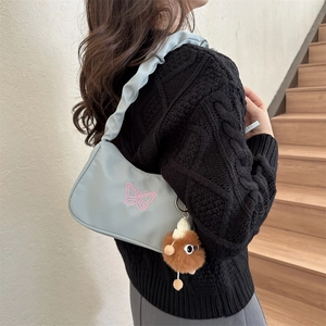 Blue nylon underarm bag with pink butterfly embroidery and ruffled shoulder strap
