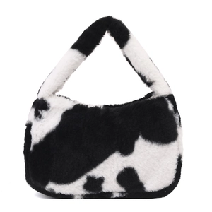 Sac à main chic en fausse fourrure avec motif vache noir et blanc et texture en peluche douce