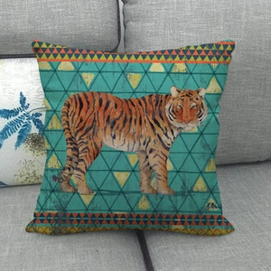 Detail of linen pillow cover with vintage tiger pattern on geometric teal background