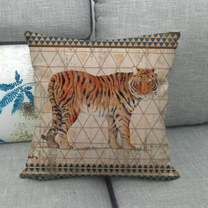 Vintage linen pillowcase with realistic tiger pattern and blue geometric borders on gray sofa