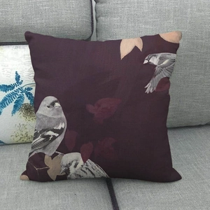 Detailed texture of linen throw pillow cover featuring oil painting birds and leaves pattern