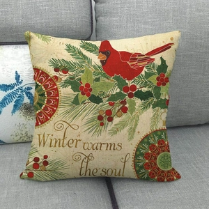 Linen pillow cover detail featuring a red cardinal bird and Winter warms the soul text