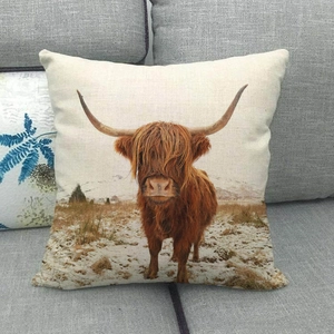 Macro view of linen texture and Highland Cow digital print on a square pillow cover