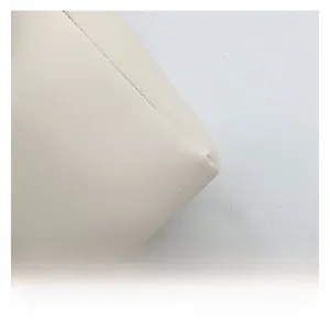 Detailed close-up showing the premium cream leather texture and neat stitching of this tote bag