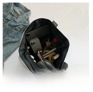 Interior view showing large capacity quilted tote bag with tablet and daily essentials