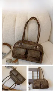 Detail of vintage coffee brown tote bag with crackle finish and silver ring strap